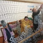 В г. Феодосии продолжается работа по плетению маскировочных сетей для российских военных